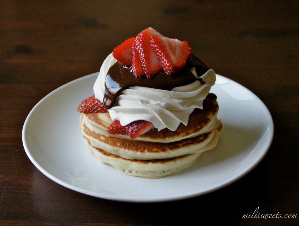 dreamy whipped cream & strawberries with ganache on top of simple homemade pancakes by Mili