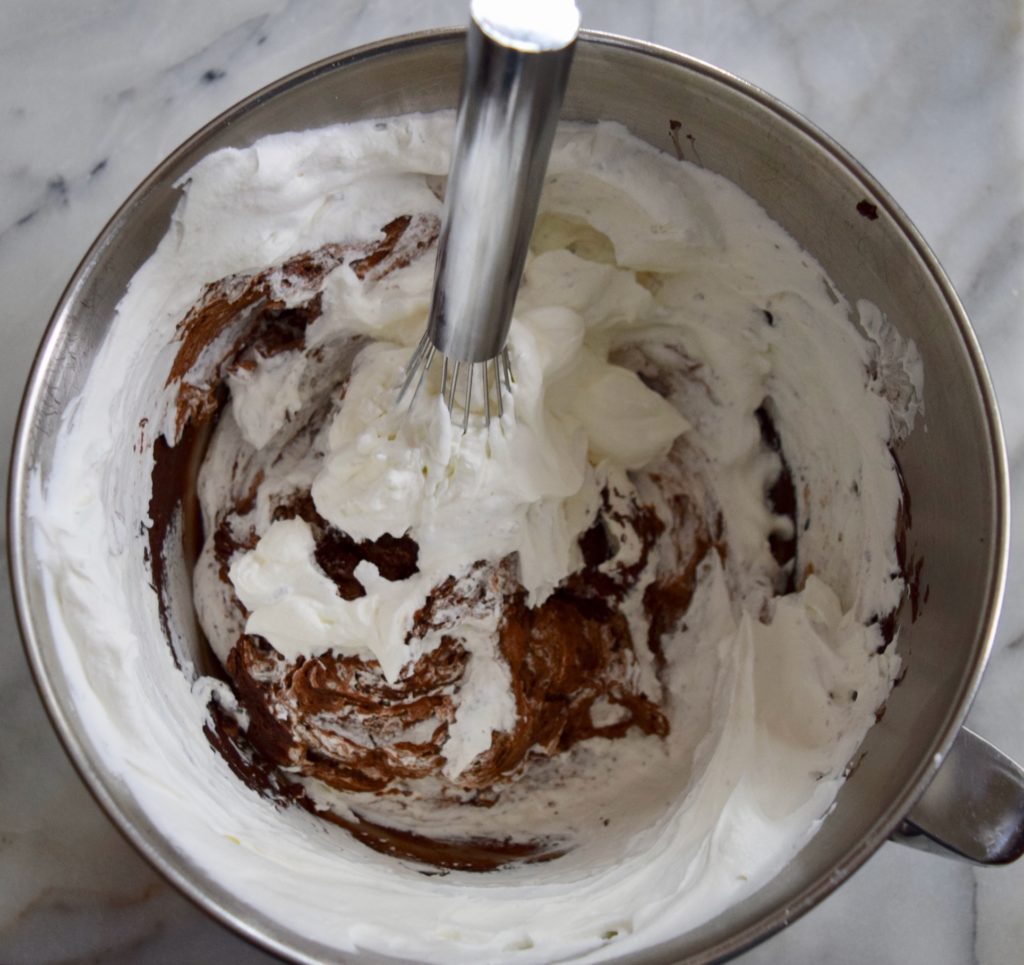 chocolate custard and whipped cream come together to make chocolate mousse